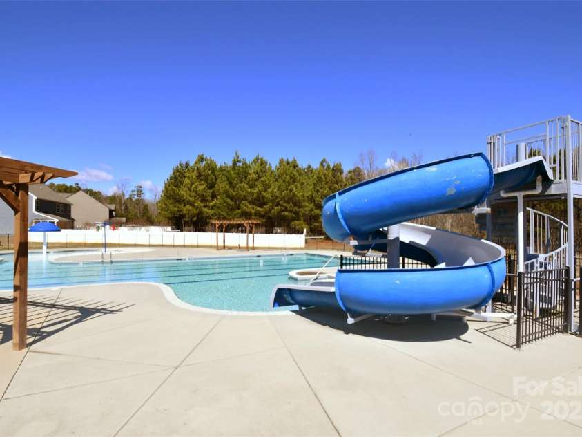 7052 Barnstone Court, Denver, NC 28037.  MLS# CAR4295531, YatesRealty ID 35068. Neighborhood Pool Water Slide