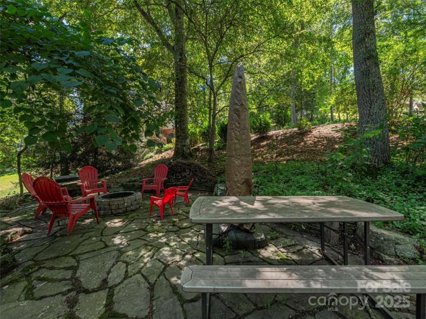 105 Deer Glade Lane, Waynesville, NC 28786.  MLS# CAR4296932, YatesRealty ID 35070. Large firepit/patio area