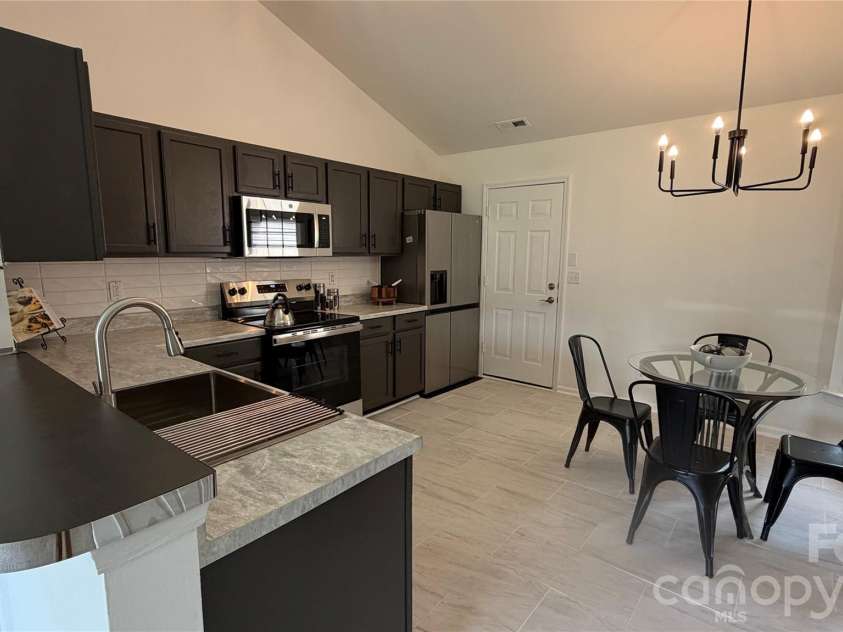 1005 LadyBank Court, Indian Trail, NC 28079.  MLS# CAR4320578, YatesRealty ID 35072. Kitchen View from Family Room