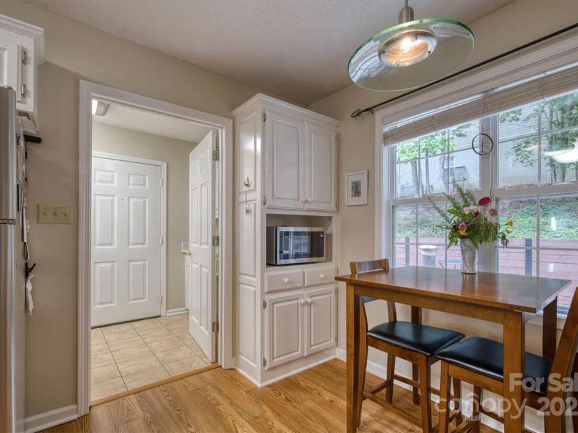 187 Yancey Road, Marion, NC 28752.  MLS# CAR4296577, YatesRealty ID 35072. Dining area and entrance  laundry area and garage