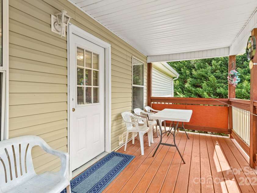 105 Robinson Cove Road, Candler, NC 28715.  MLS# CAR4293915, YatesRealty ID 35076. Back deck