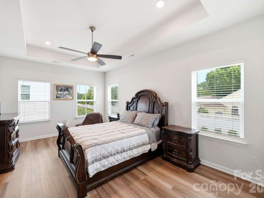 1943 Plath Top Road, Rock Hill, SC 29732.  MLS# CAR4398720, YatesRealty ID 35086. Impressive primary bedroom with natural light, tray ceiling, recessed lights, upgraded ceiling fan and two walk-in closets.