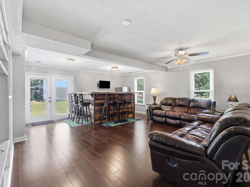 3970 Tenneyson Court, Concord, NC 28027.  MLS# CAR4398947, YatesRealty ID 35089. Den is wired for surround sound. Bar does not convey.