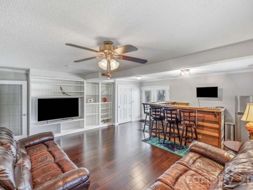 3970 Tenneyson Court, Concord, NC 28027.  MLS# CAR4398947, YatesRealty ID 35089. Den or Man Cave with built-in shelving