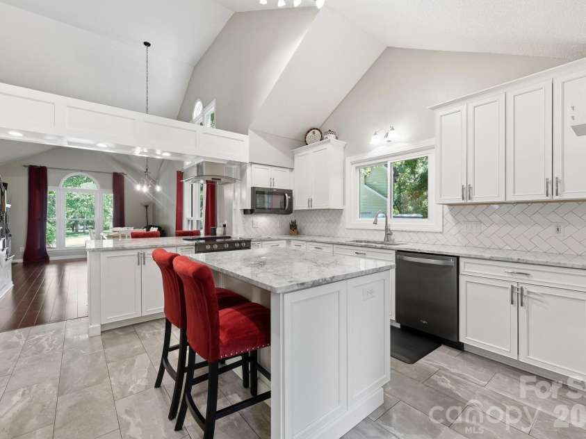 3970 Tenneyson Court, Concord, NC 28027.  MLS# CAR4398947, YatesRealty ID 35089. Kitchen with vaulted ceilings, open to dining area and flex space
