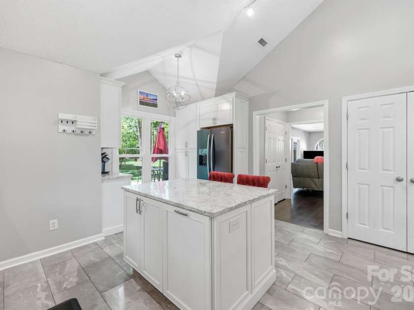 3970 Tenneyson Court, Concord, NC 28027.  MLS# CAR4398947, YatesRealty ID 35089. Large kitchen island with seating