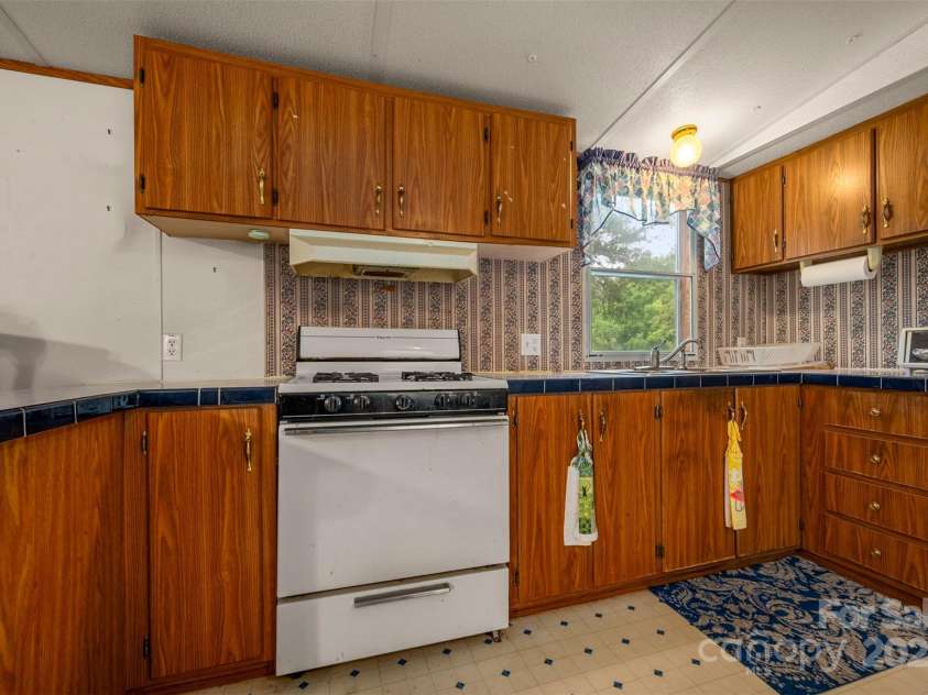 423 Womack Road, Mill Spring, NC 28756.  MLS# CAR4294084, YatesRealty ID 35093. 