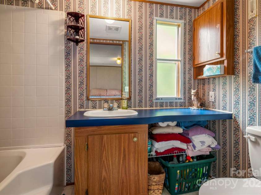 423 Womack Road, Mill Spring, NC 28756.  MLS# CAR4294084, YatesRealty ID 35093. 