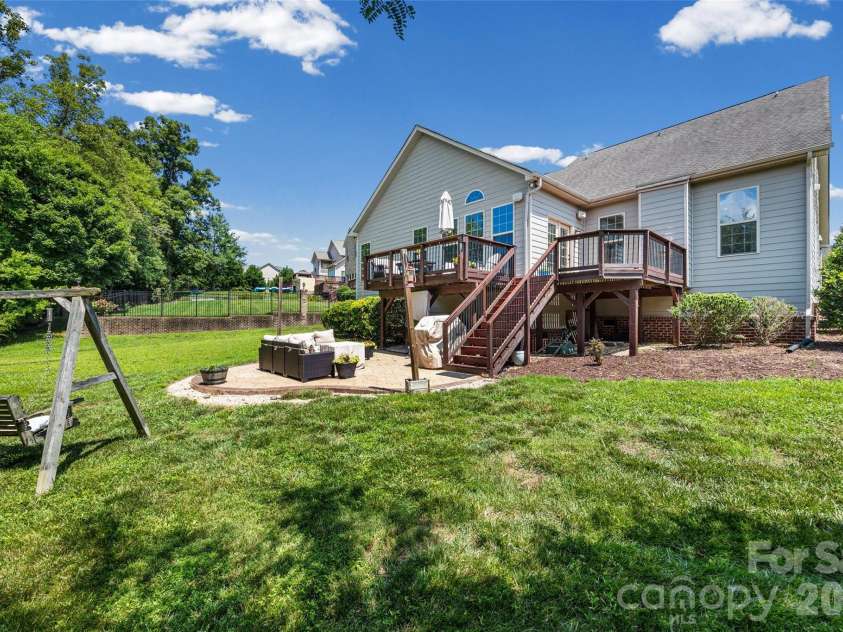 8477 Whitworth Avenue, Harrisburg, NC 28075.  MLS# CAR4399268, YatesRealty ID 35095. Back yard