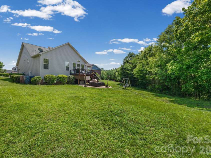 8477 Whitworth Avenue, Harrisburg, NC 28075.  MLS# CAR4399268, YatesRealty ID 35095. Back yard