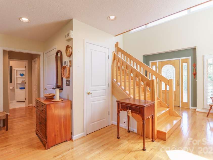 51 Windy Acres Drive, Fairview, NC 28730.  MLS# CAR4297537, YatesRealty ID 35098. Foyer and front door
