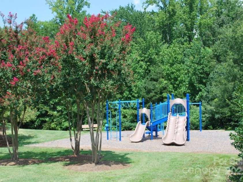 19112 Glouster Court, Cornelius, NC 28031.  MLS# CAR4291361, YatesRealty ID 35099. Community playground beside pool