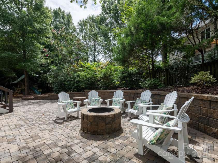 19112 Glouster Court, Cornelius, NC 28031.  MLS# CAR4291361, YatesRealty ID 35099. Mature landscaping provides green buffer for privacy.  S'mores for fall!!