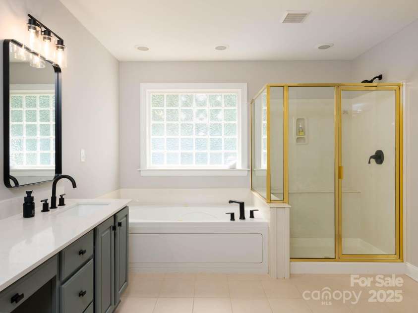 19112 Glouster Court, Cornelius, NC 28031.  MLS# CAR4291361, YatesRealty ID 35099. Updated primary bath with new shower enclosure coming!