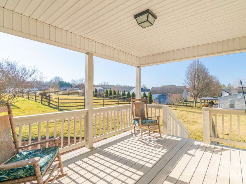 1243 Glory Court, Oakboro, NC 28129.  MLS# CAR4219017, YatesRealty ID 3510. Enjoy evening coffee or cocktails on the beautiful rear porch!