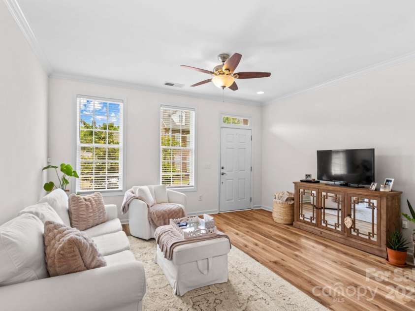 15879 Sharon Dale Drive, Davidson, NC 28036.  MLS# CAR4286571, YatesRealty ID 35111. Bright living room painted in Alabaster White. A pet free home.