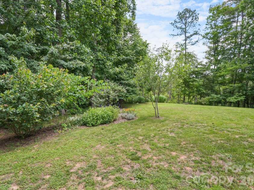 24 Merriwood Trail, Arden, NC 28704.  MLS# CAR4396503, YatesRealty ID 35111. Large level backyard
