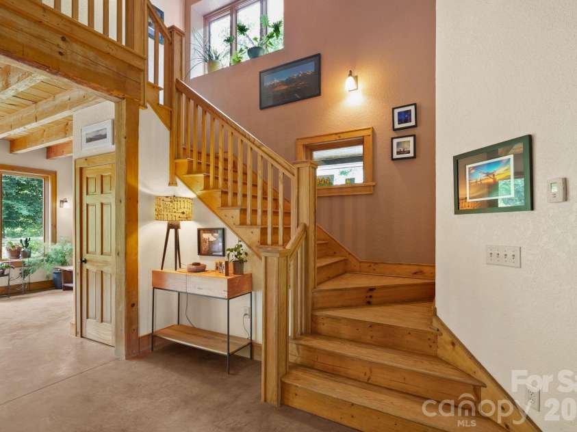 24 Merriwood Trail, Arden, NC 28704.  MLS# CAR4396503, YatesRealty ID 35111. Open staircase to upper level