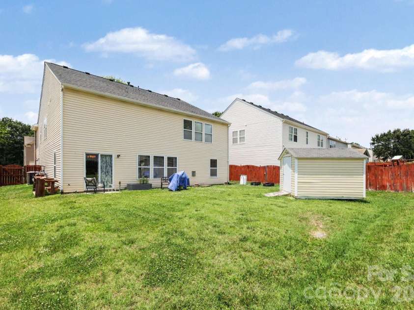 5654 Hammermill Drive, Harrisburg, NC 28075.  MLS# CAR4390875, YatesRealty ID 35116. Flat, fenced backyard