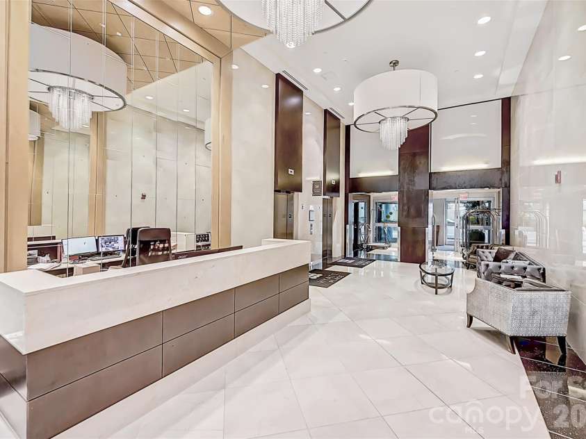 222 Caldwell Street, Charlotte, NC 28202.  MLS# CAR4362298, YatesRealty ID 3512. Lobby/concierge desk.