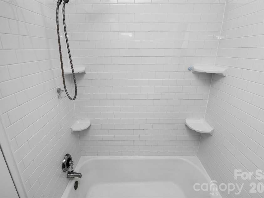 219 Wakefield Drive, Charlotte, NC 28209.  MLS# CAR4396863, YatesRealty ID 35136. Tile shower