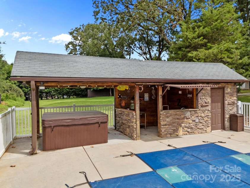 8900 Old Concord Road, Salisbury, NC 28146.  MLS# CAR4295325, YatesRealty ID 35140. Hot tub with outdoor bar area