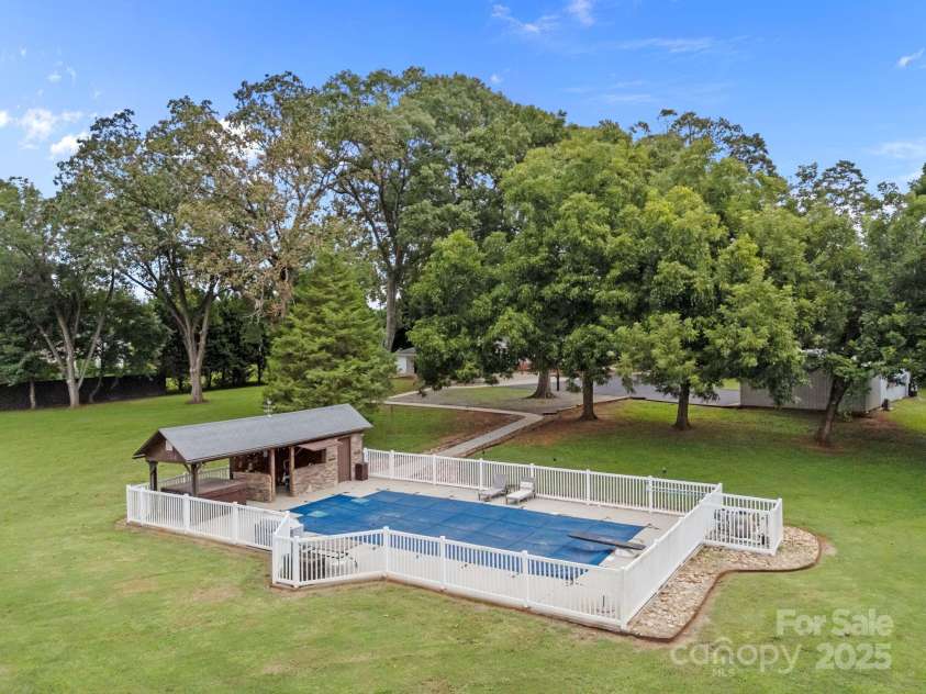 8900 Old Concord Road, Salisbury, NC 28146.  MLS# CAR4295325, YatesRealty ID 35140. Salt water pool, hot tub, outdoor bar & pool bathhouse