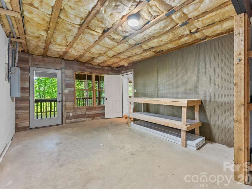 287 Dvdisdi Court, Brevard, NC 28712.  MLS# CAR4358240, YatesRealty ID 35141. Lower Level Workshop Space