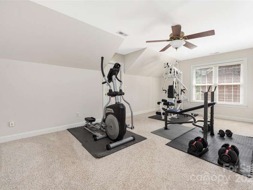 9603 Devonshire Drive, Huntersville, NC 28078.  MLS# CAR4292851, YatesRealty ID 35141. Bonus room being used as a home gym but could easily serve as a second family room.