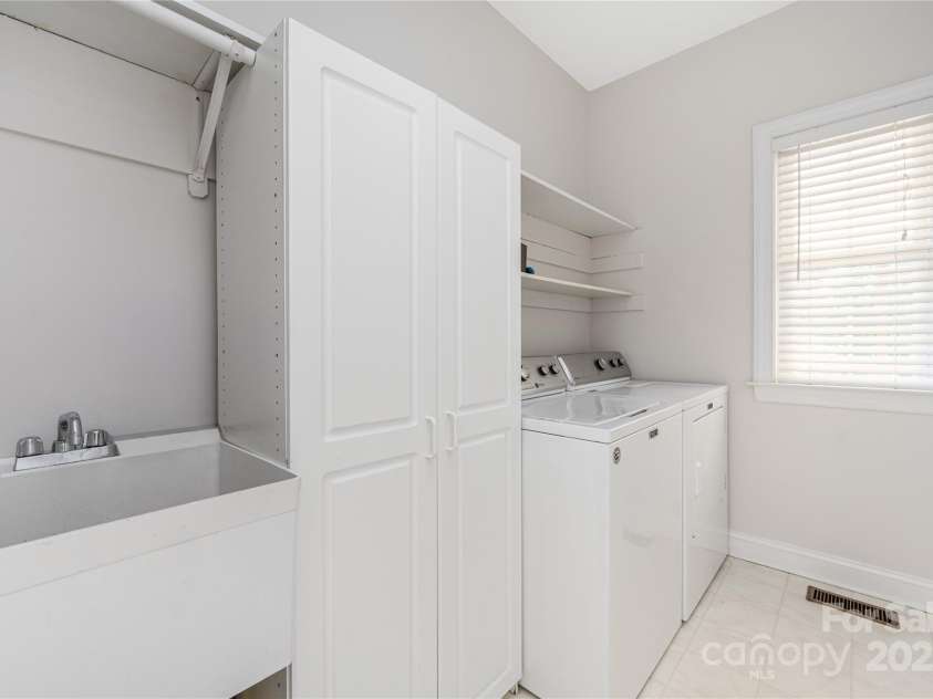 9603 Devonshire Drive, Huntersville, NC 28078.  MLS# CAR4292851, YatesRealty ID 35141. Laundry room on main level with utility sink and good storage for easy home organization.