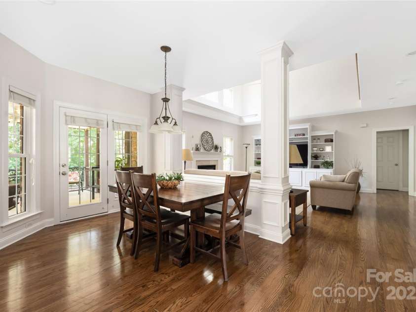 9603 Devonshire Drive, Huntersville, NC 28078.  MLS# CAR4292851, YatesRealty ID 35141. Picture shows the large eat-in space looking out to the screened porch.