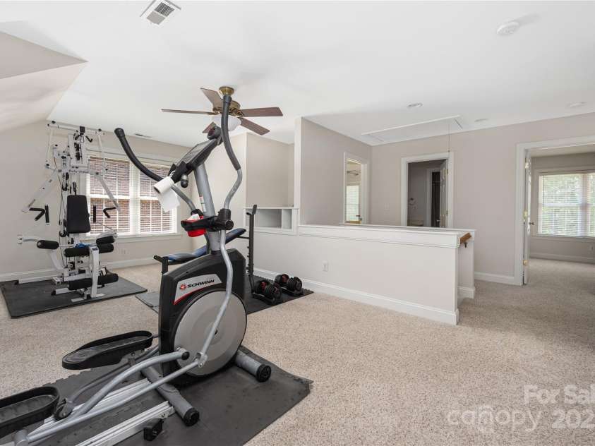 9603 Devonshire Drive, Huntersville, NC 28078.  MLS# CAR4292851, YatesRealty ID 35141. The uses for this space are many... home gym as pictured, second work from home space, second family room.