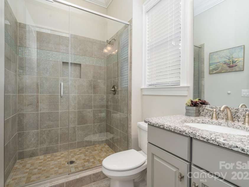 6211 Jepson Court, Charlotte, NC 28214.  MLS# CAR4293083, YatesRealty ID 35158. Attached guest bathroom on the main level of the house.