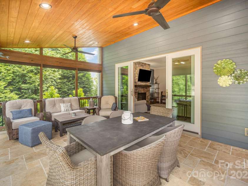 6211 Jepson Court, Charlotte, NC 28214.  MLS# CAR4293083, YatesRealty ID 35158. Beautiful wood ceiling with travertine tile floors.