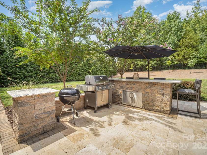 6211 Jepson Court, Charlotte, NC 28214.  MLS# CAR4293083, YatesRealty ID 35158. Built in grill and bar area with Travertine Tile.