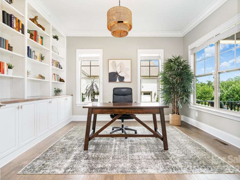 6211 Jepson Court, Charlotte, NC 28214.  MLS# CAR4293083, YatesRealty ID 35158. Office with French doors and custom built in shelving and cabinetry.