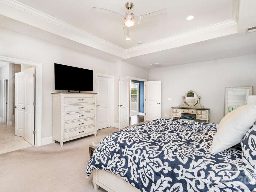 6211 Jepson Court, Charlotte, NC 28214.  MLS# CAR4293083, YatesRealty ID 35158. Primary bedroom showing entry to attached primary bathroom.