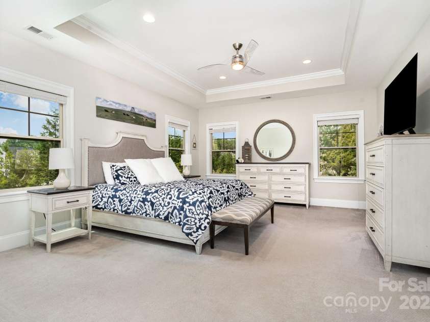 6211 Jepson Court, Charlotte, NC 28214.  MLS# CAR4293083, YatesRealty ID 35158. Primary bedroom with his and her closets and attached primary bathroom.