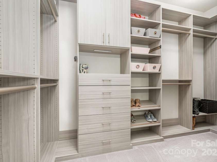6211 Jepson Court, Charlotte, NC 28214.  MLS# CAR4293083, YatesRealty ID 35158. Second primary closet with custom built in cabinets and shelving.