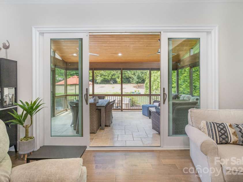 6211 Jepson Court, Charlotte, NC 28214.  MLS# CAR4293083, YatesRealty ID 35158. Sliding doors from the living room to the screened in porch.