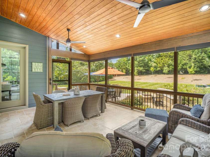 6211 Jepson Court, Charlotte, NC 28214.  MLS# CAR4293083, YatesRealty ID 35158. Spacious screened in porch with Travertine tile floors.