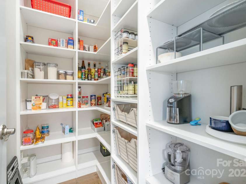 6211 Jepson Court, Charlotte, NC 28214.  MLS# CAR4293083, YatesRealty ID 35158. Walk in pantry with custom built in shelving.