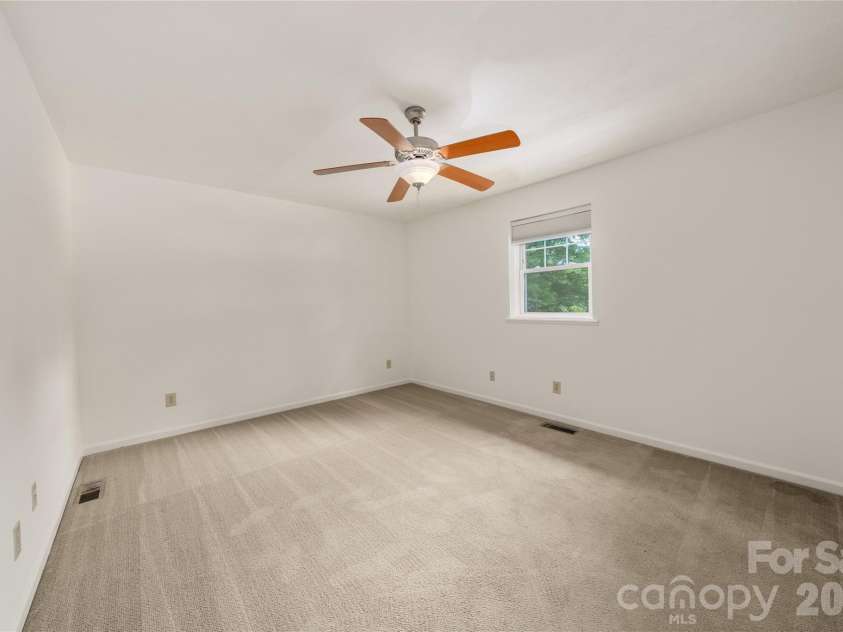 8 Wedgewood Drive, Mills River, NC 28759.  MLS# CAR4398096, YatesRealty ID 35159. Bedroom 2 with custom black out shade