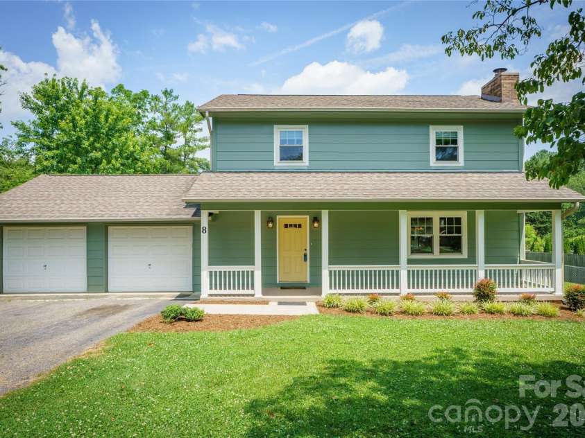 8 Wedgewood Drive, Mills River, NC 28759.  MLS# CAR4398096, YatesRealty ID 35159. Enjoy this covered rocking chair front porch with your morning coffee and admire your tree lined front property.