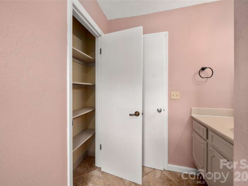 8 Wedgewood Drive, Mills River, NC 28759.  MLS# CAR4398096, YatesRealty ID 35159. Hall bath with large linen closet