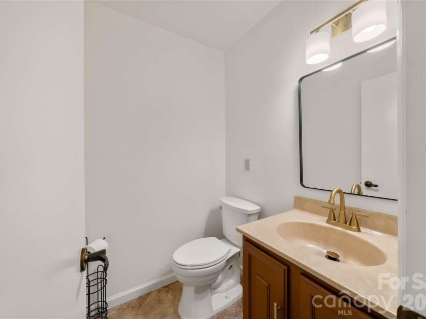 8 Wedgewood Drive, Mills River, NC 28759.  MLS# CAR4398096, YatesRealty ID 35159. Main level water closet