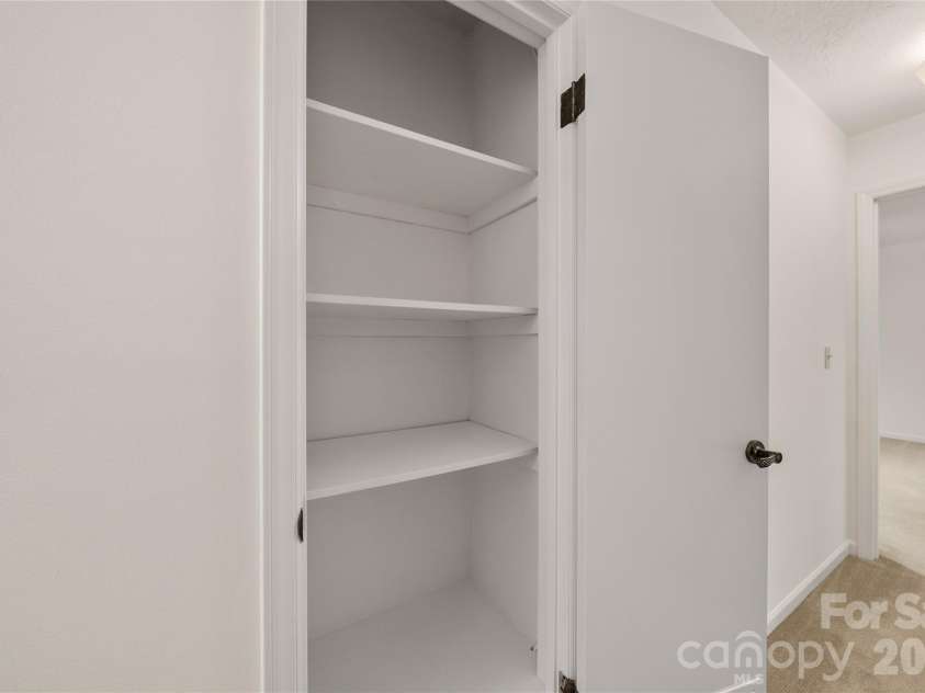 8 Wedgewood Drive, Mills River, NC 28759.  MLS# CAR4398096, YatesRealty ID 35159. Upper hall storage closet