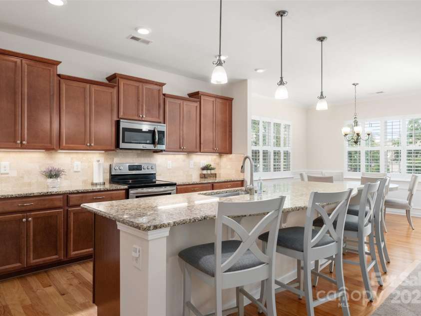 2050 Aberdeen Lane, Indian Land, SC 29707.  MLS# CAR4294584, YatesRealty ID 35161. An Abundance of Cabinets with a long island that accommodates counter height bar stools