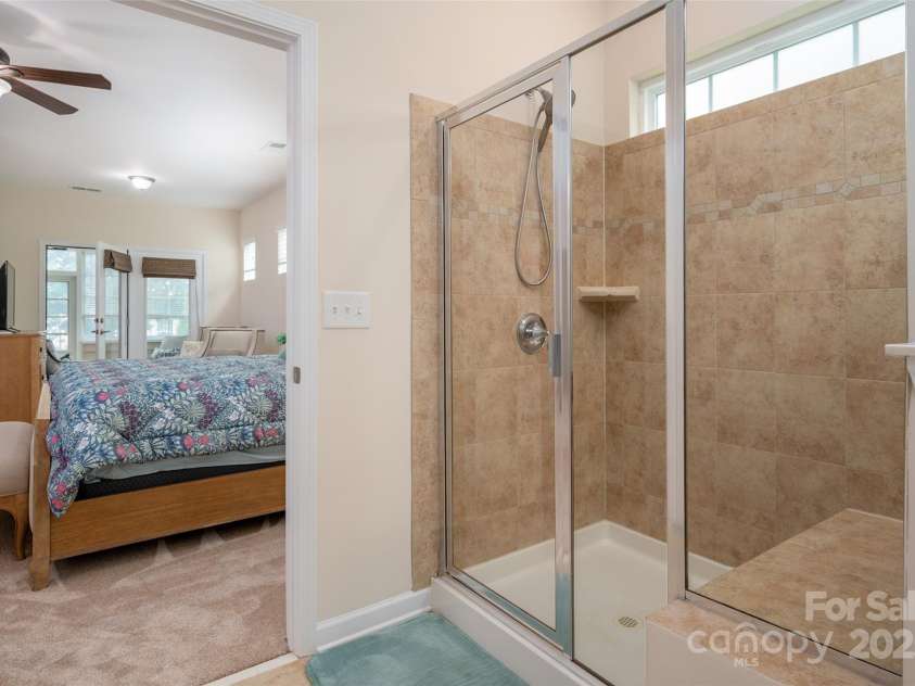 2050 Aberdeen Lane, Indian Land, SC 29707.  MLS# CAR4294584, YatesRealty ID 35161. Travestine Tile Walk In Shower With Built in Shower