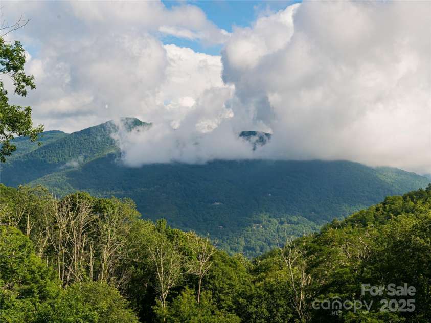 82 Gadohi Trail, Maggie Valley, NC 28751.  MLS# CAR4283632, YatesRealty ID 35163. Amazing mountain views from deck and home